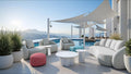 Modern outdoor patio withred and green ottoman, white furniture, pool, and scenic view