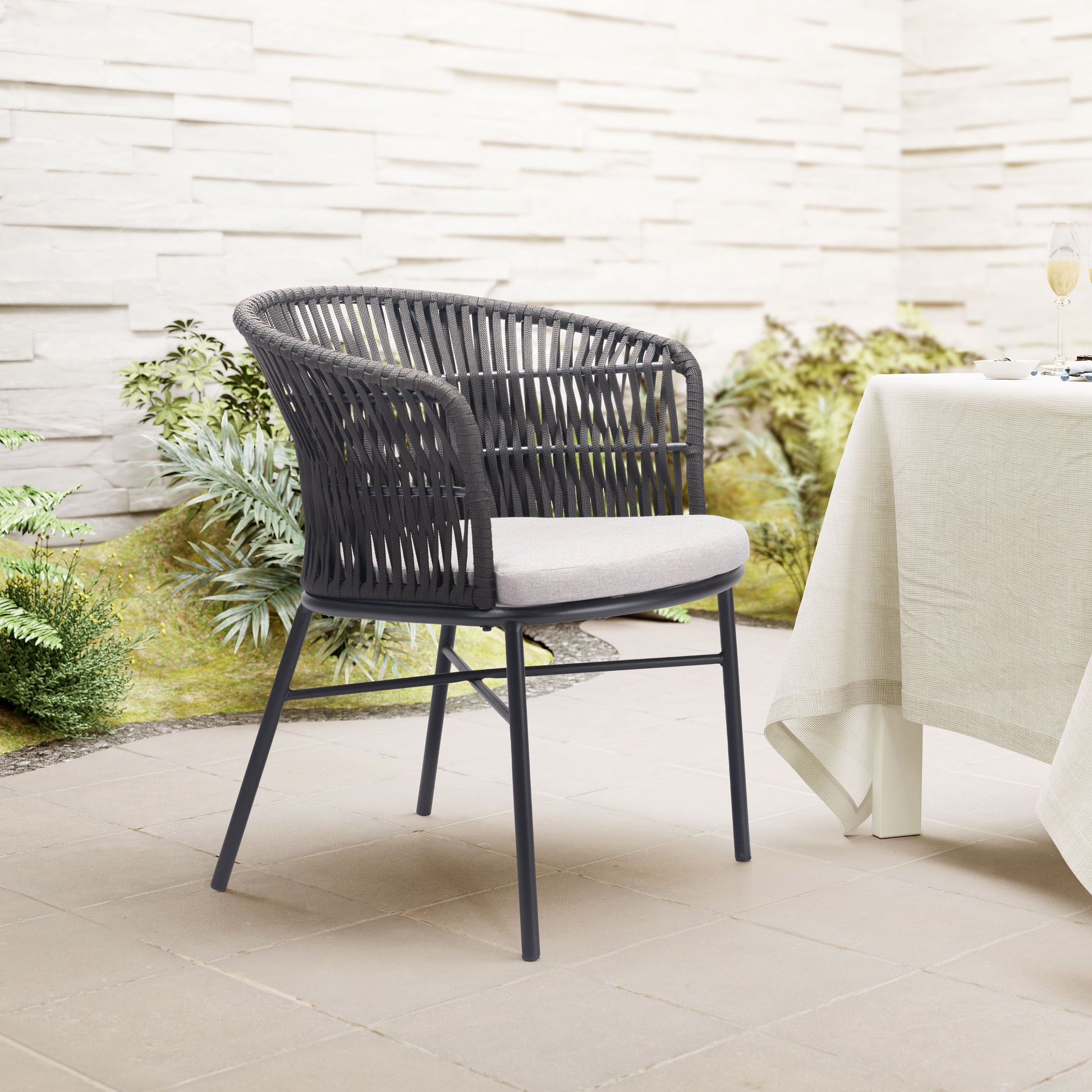 cream woven accent chair in a coastal guest room setting