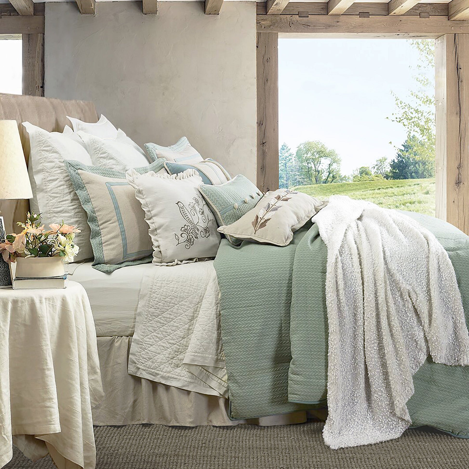 neutral linen comforter set styled in a coastal elegant dining room