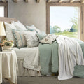 earth-toned marble comforter set styled in a transitional serene master suite