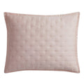 Pink quilted pillow on a white background