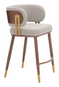 Front angle view of the Brew Counter Stool Beige & Walnut, highlighting the curved upholstered seat and gold hardware.