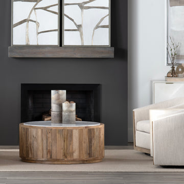 charcoal textured accent table in a coastal guest room setting