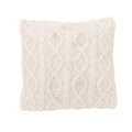 Knitted cream pillow on a white background