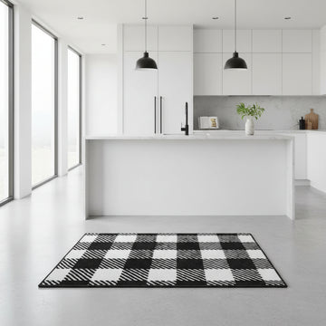 Modern kitchen with a black and white checkered rug on the floor.