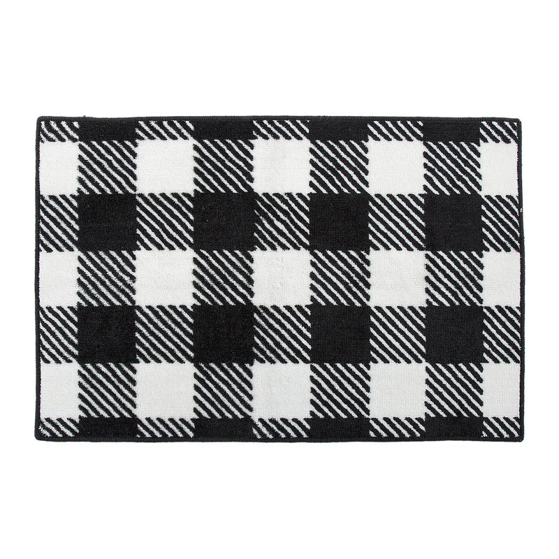 Modern kitchen with a black and white checkered rug on the floor.