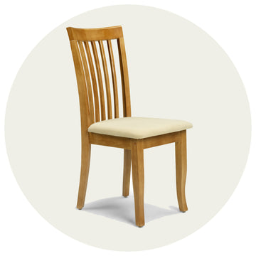 Wooden chair with a cream cushion on a white background