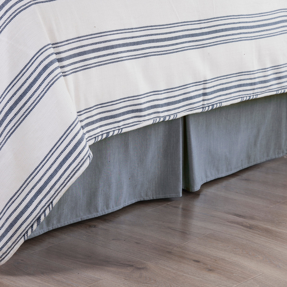walnut linen bed frame styled in a coastal elegant dining room