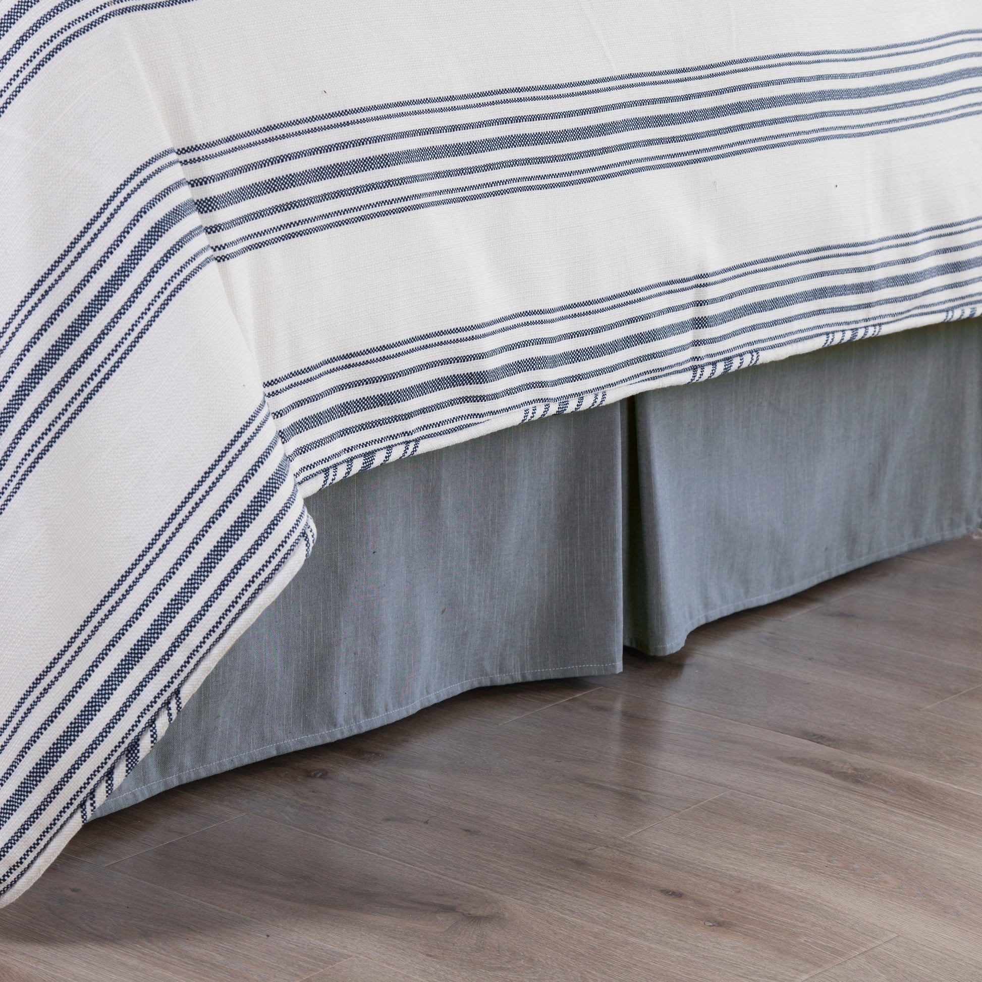 walnut linen bed frame styled in a coastal elegant dining room