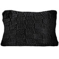 Dark gray textured pillow on a white background