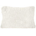 Textured white pillow on a white background