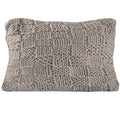 charcoal brushed metal decorative pillow styled in a mid-century minimalist entryway