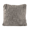 beige plush decorative pillow in a coastal guest room setting