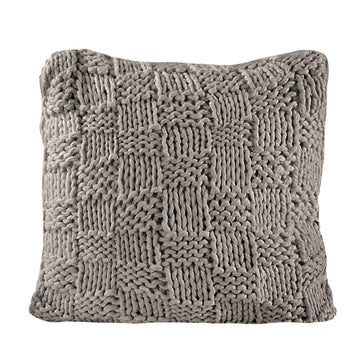 warm-toned brushed metal pillow sham styled in a mid-century minimalist entryway