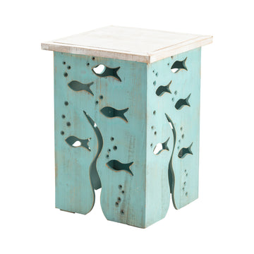 gray canvas accent table in a coastal guest room setting
