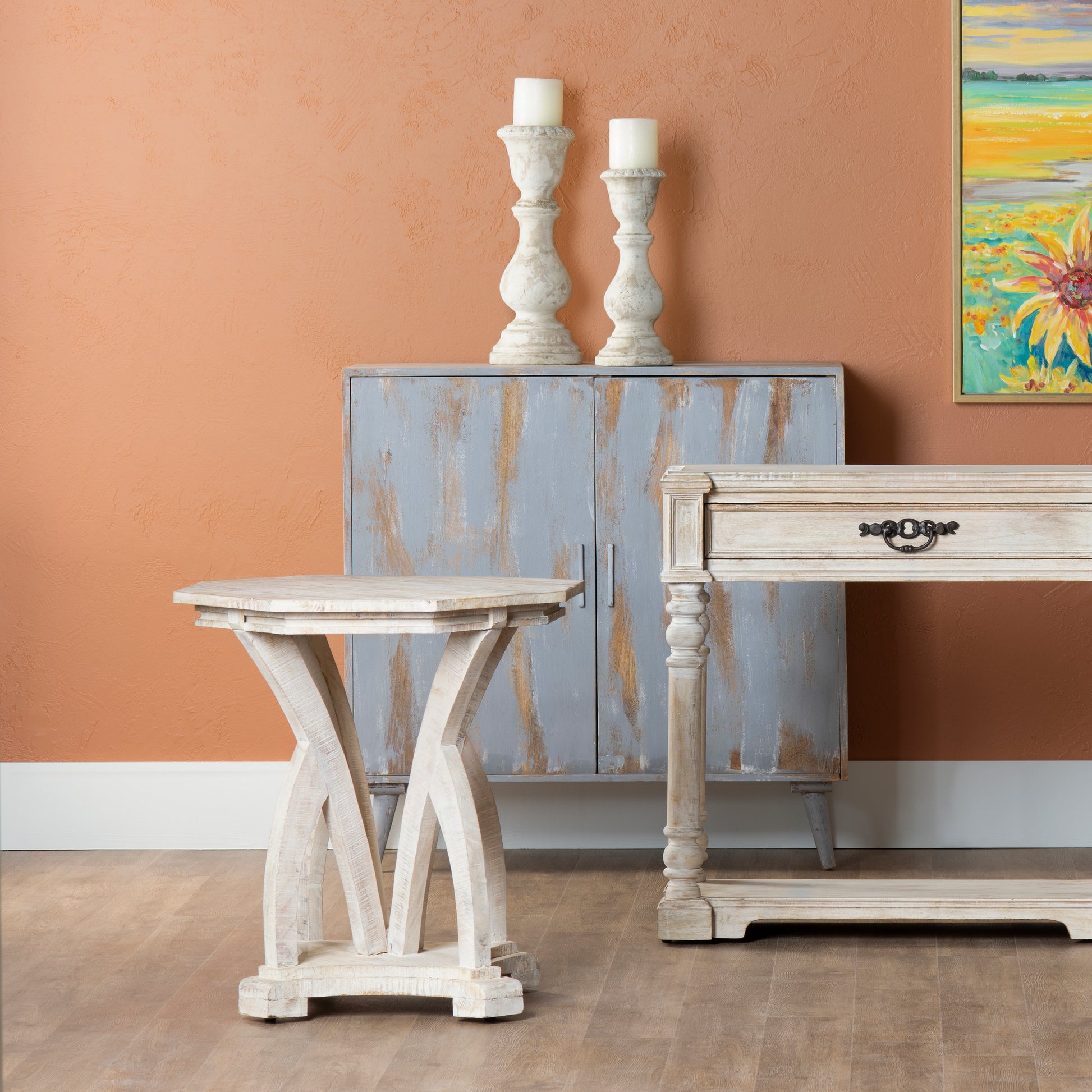 white brushed accent table in a contemporary cozy bedroom setting
