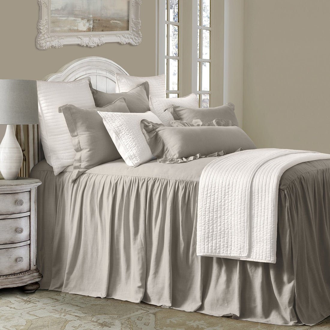 soft gray solid wood bed frame styled in a farmhouse chic modern living room