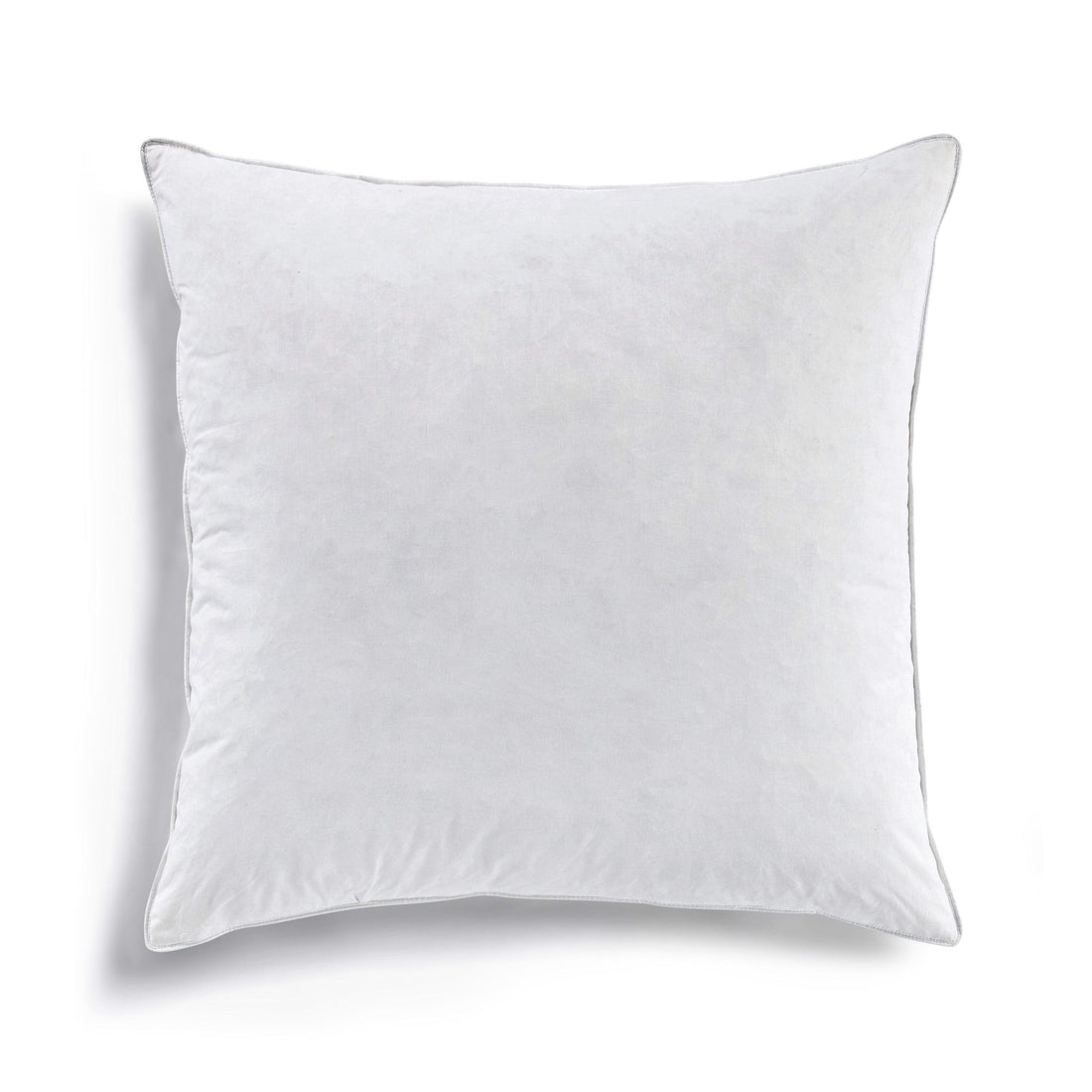 white brushed decorative pillow in a elegant modern bedroom setting