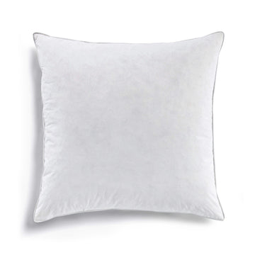 white brushed decorative pillow in a elegant modern bedroom setting