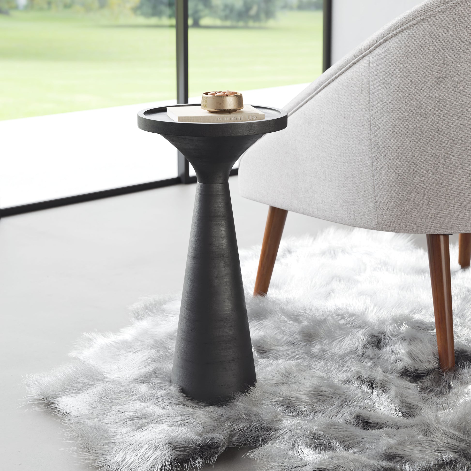charcoal textured accent table in a farmhouse contemporary bedroom setting