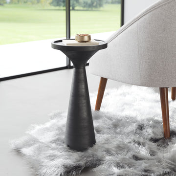 charcoal textured accent table in a farmhouse contemporary bedroom setting