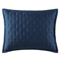 Navy blue textured pillow on a white background