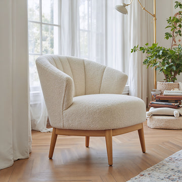 warm-toned soft accent chair in a refined master bedroom setting