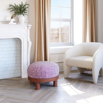 beige plush ottoman in a transitional living room setting