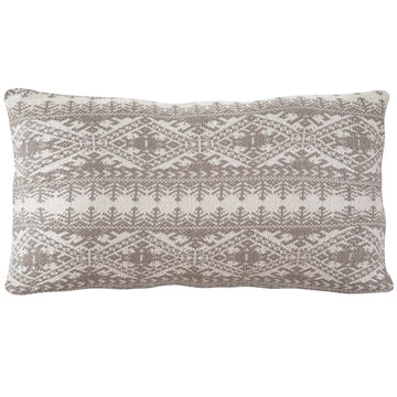 charcoal textured decorative pillow in a minimalist dining room setting
