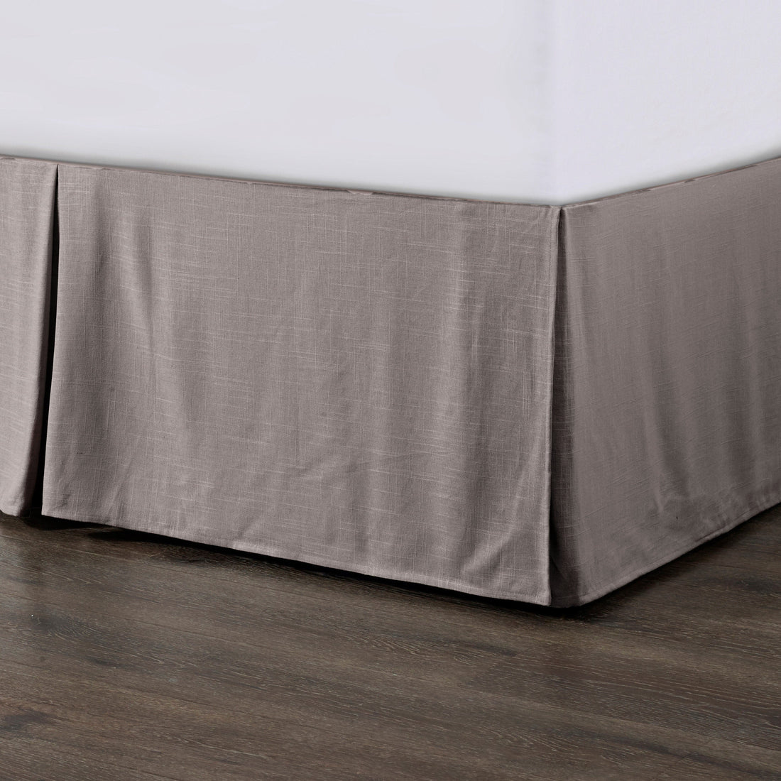 cream brushed metal bed frame styled in a contemporary minimalist entryway