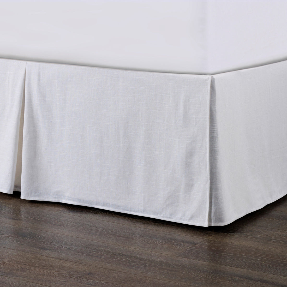 cream brushed metal bed frame styled in a contemporary minimalist entryway