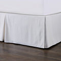 cream brushed metal bed frame styled in a contemporary minimalist entryway