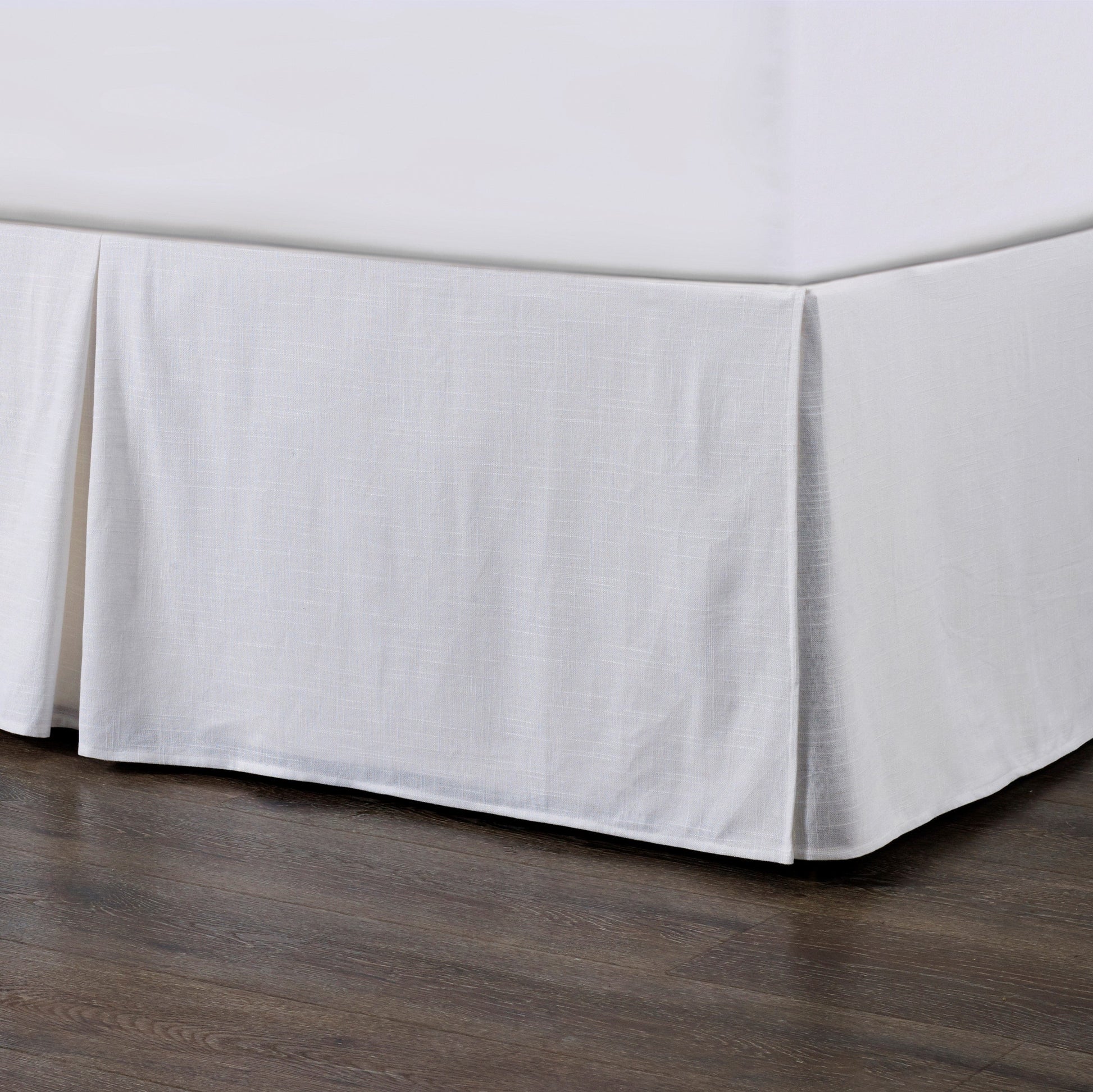 cream brushed metal bed frame styled in a contemporary minimalist entryway