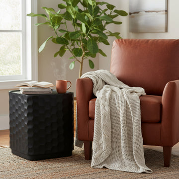 cream woven accent table in a minimalist dining room setting
