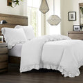 cream brushed metal comforter set styled in a contemporary minimalist entryway