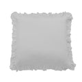 White pillow with ruffled edges on a white background