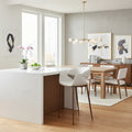 Modern kitchen with white island, wooden dining table, and Limay Barstools Beige & Walnut