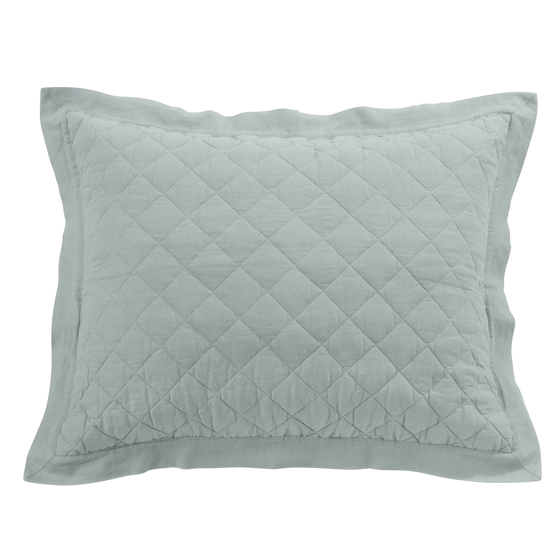 natural fabric pillow sham in a farmhouse cozy bedroom setting