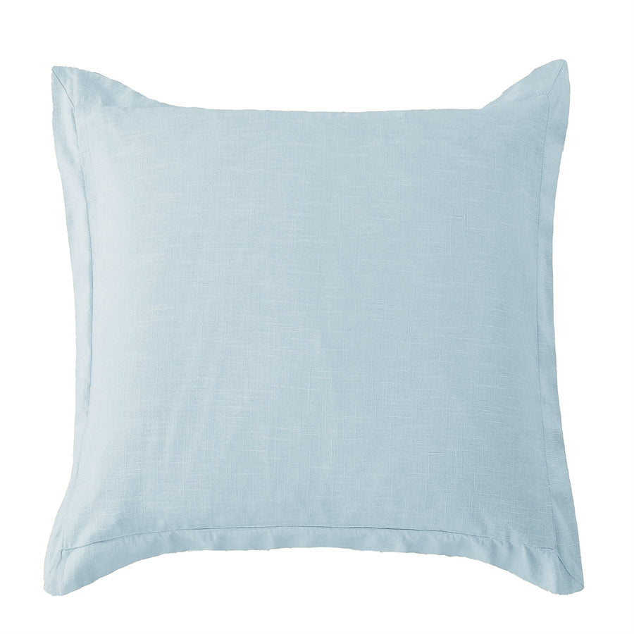 Light blue pillow on a white background