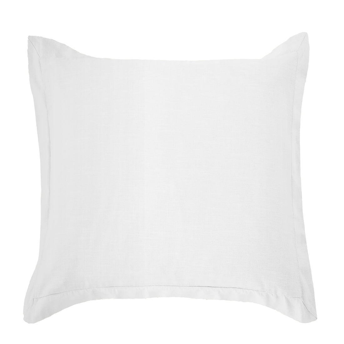 neutral linen pillow sham styled in a minimalist elegant dining room