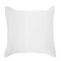 neutral linen pillow sham styled in a minimalist elegant dining room
