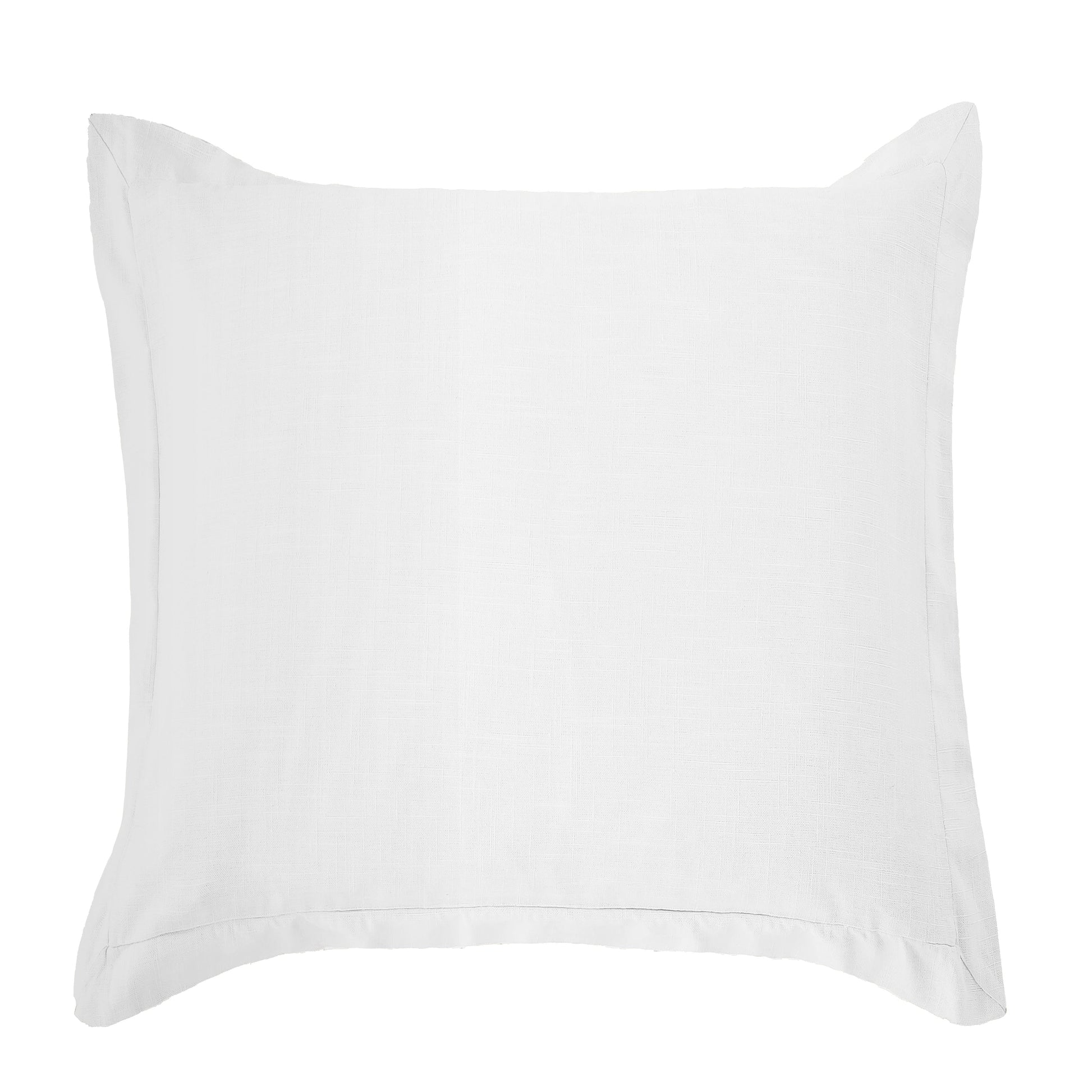 neutral linen pillow sham styled in a minimalist elegant dining room