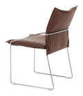 Brown pola dining chair with metal frame on a white background