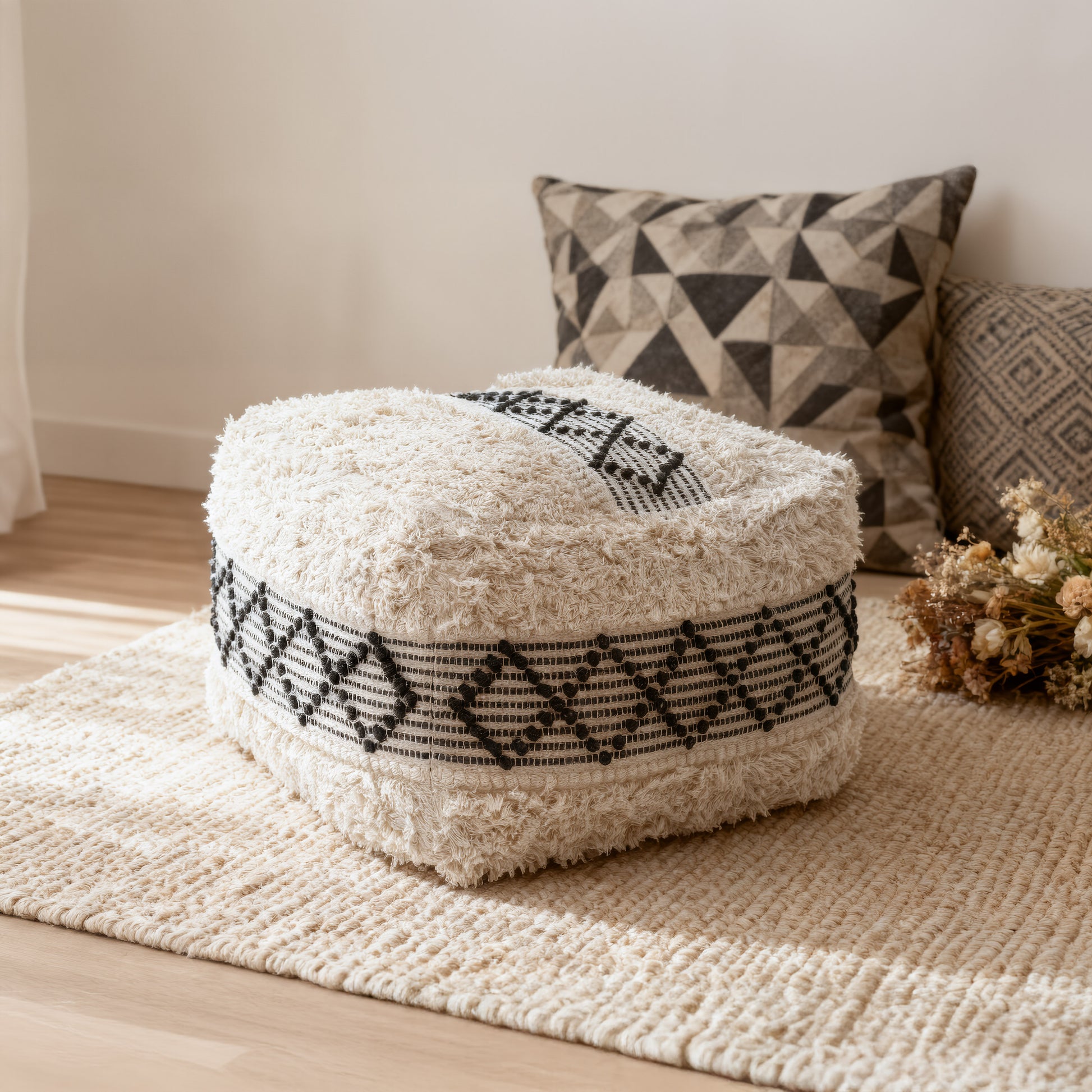natural velvet ottoman in a minimalist dining room setting