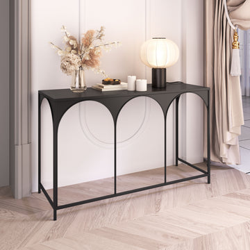neutral-toned linen accent table in a coastal guest room setting