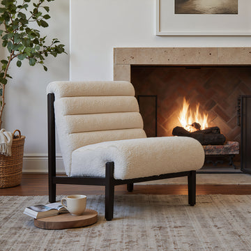 white brushed accent chair in a elegant modern bedroom setting