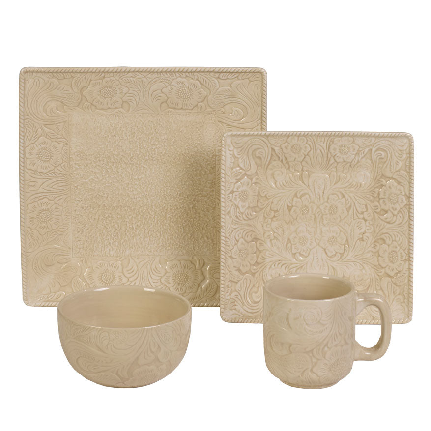 Beige ceramic dinnerware set with embossed patterns on a white background