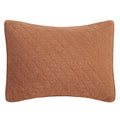 Quilted brown pillow on a white background