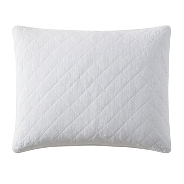 ivory soft pillow sham in a farmhouse cozy bedroom setting