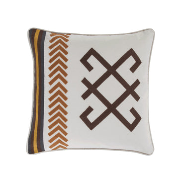 earth-toned textured decorative pillow in a contemporary master bedroom setting